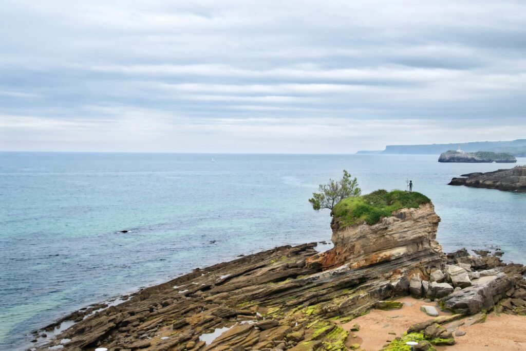 Stunning coastal scenery with unique rock formations and calm sea.