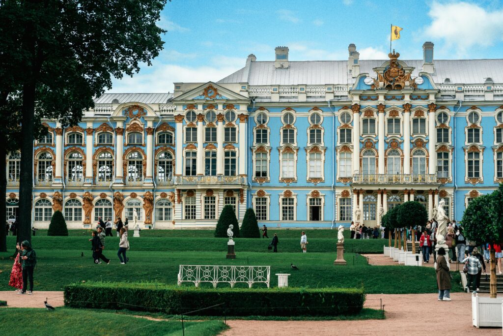 Beautiful view of Catherine Palace in Russia with visiting tourists enjoying the sunny day.