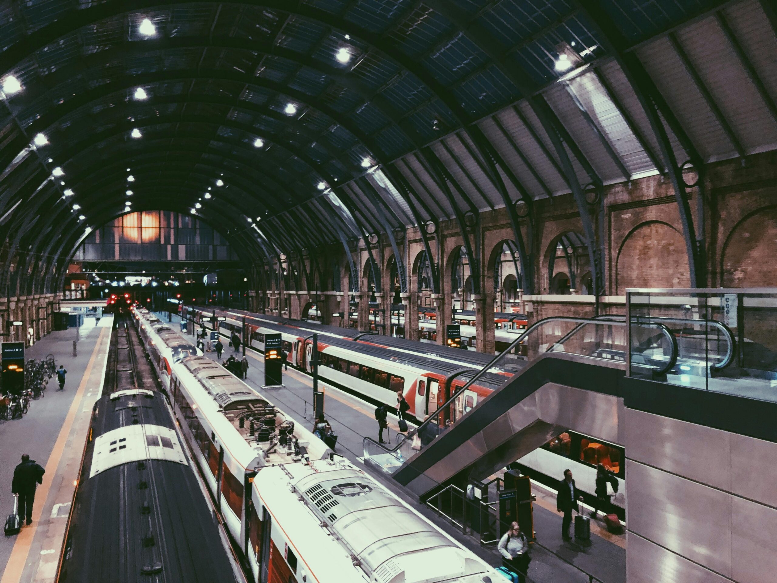 Dynamic view of a busy train station in England with commuters on the move.