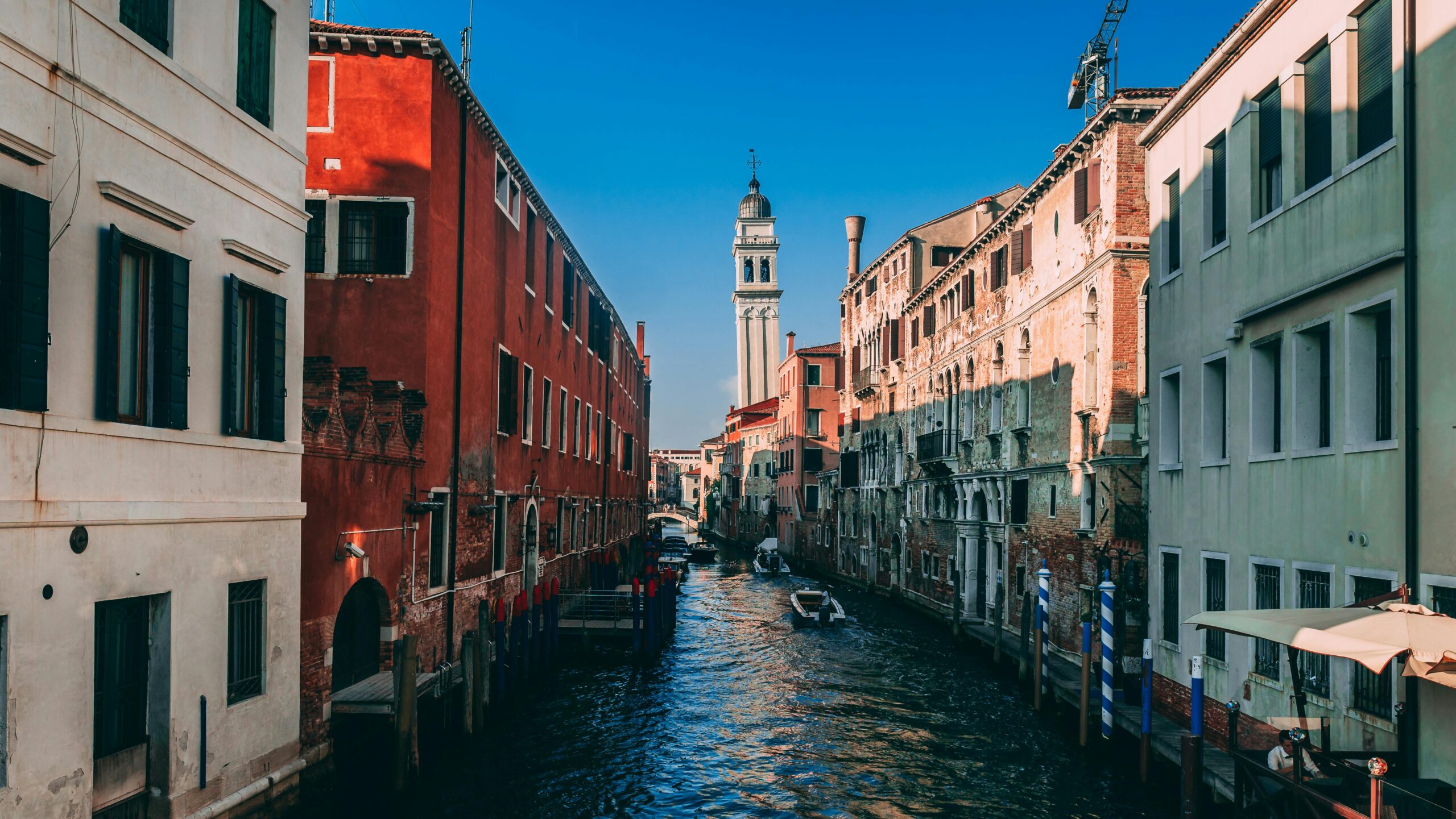 Stunning view of a historic canal in Venice, Italy, surrounded by classic architecture.