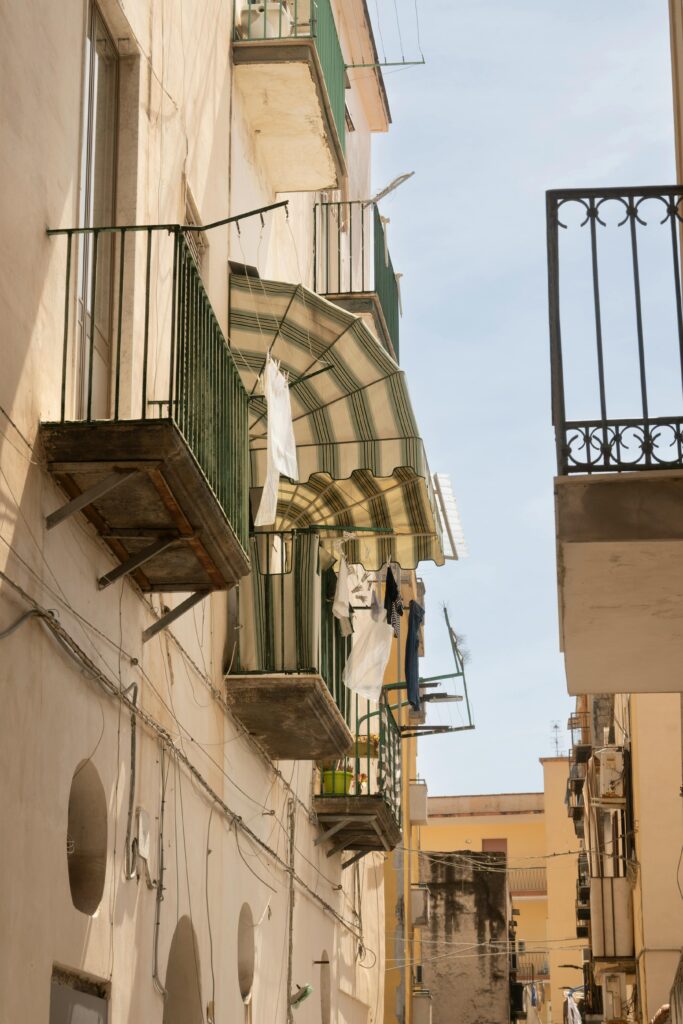 Italian balconies with hanging laundry capture the charm of daily life under the sun.