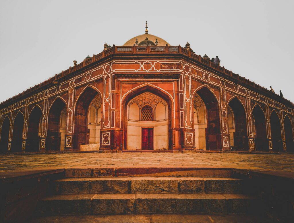 Stunning view of Humayun's Tomb with intricate Mughal architecture in daylight, Delhi.