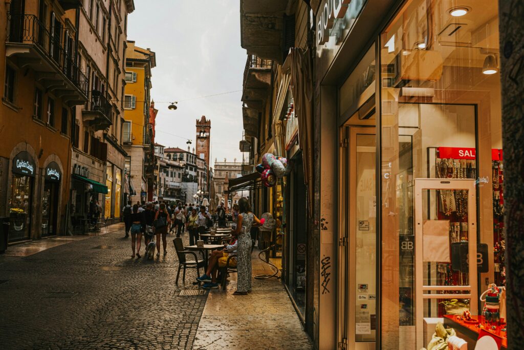 Bustling European street with shops and cafes, ideal for cultural exploration.