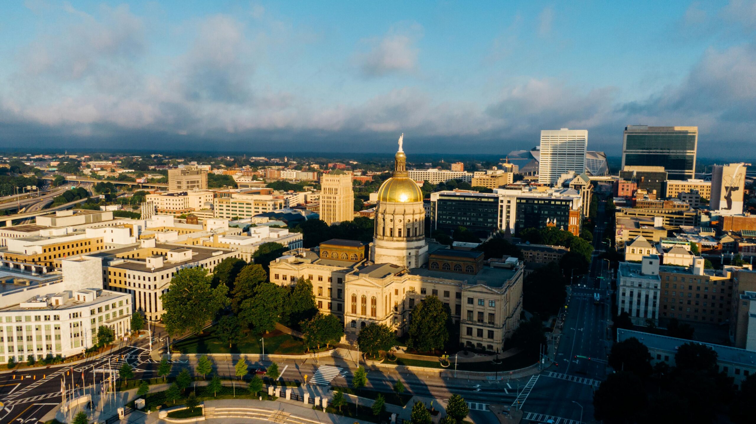 A stunning drone capture of Atlanta's skyline featuring the Georgia State Capitol.