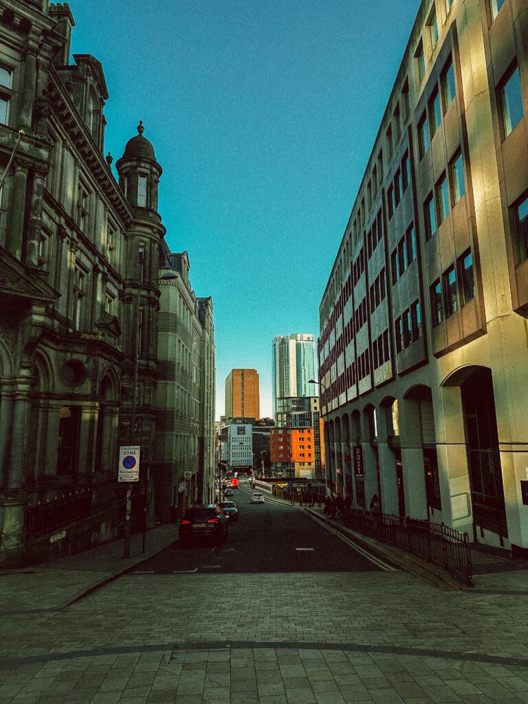 Charming Birmingham street view showcasing blend of historic and modern architecture.