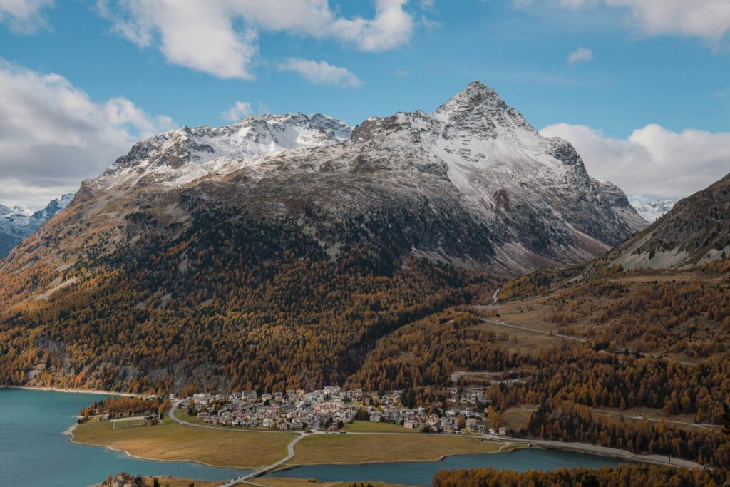 A breathtaking autumn view of snow-capped mountains in Graubünden, Switzerland.