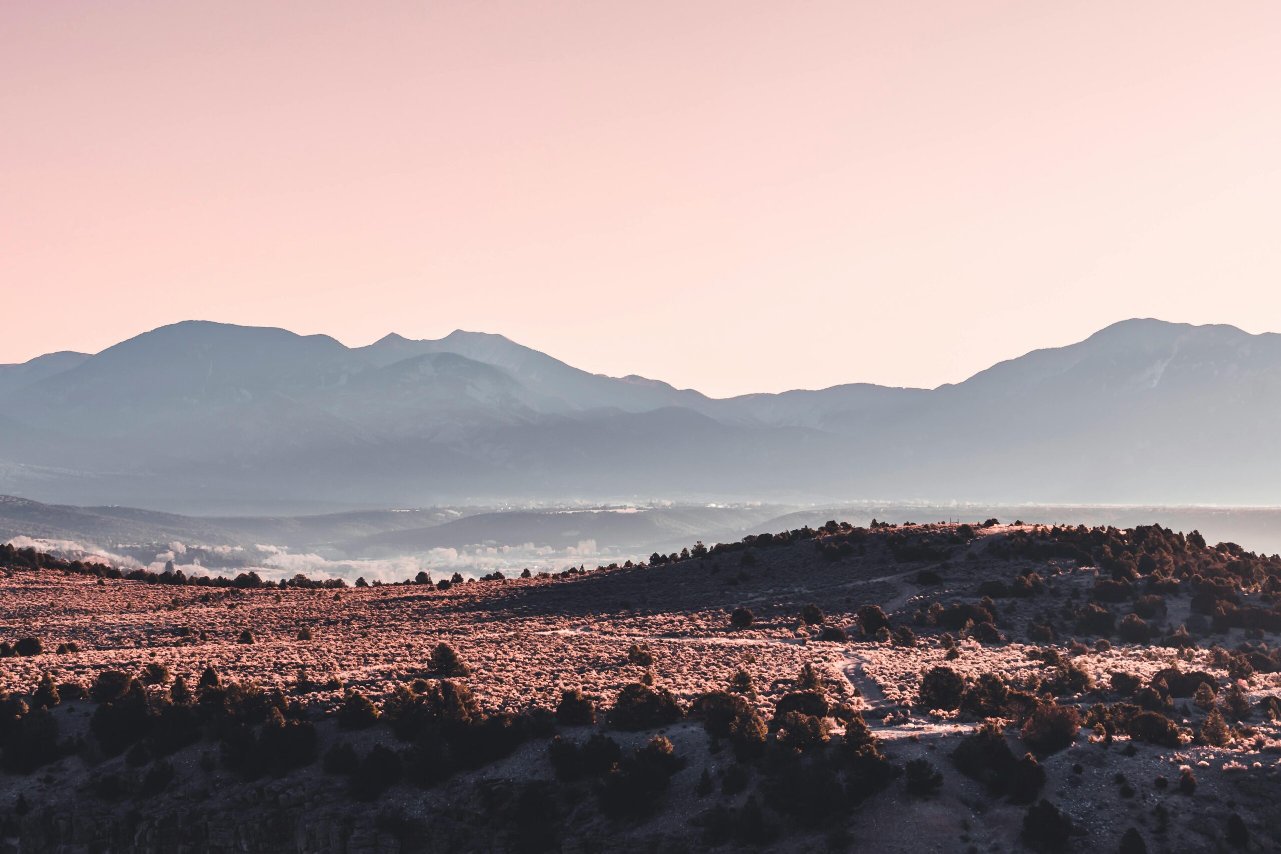 Breathtaking view of Big Bend National Park's mountains under a soft sunrise sky.