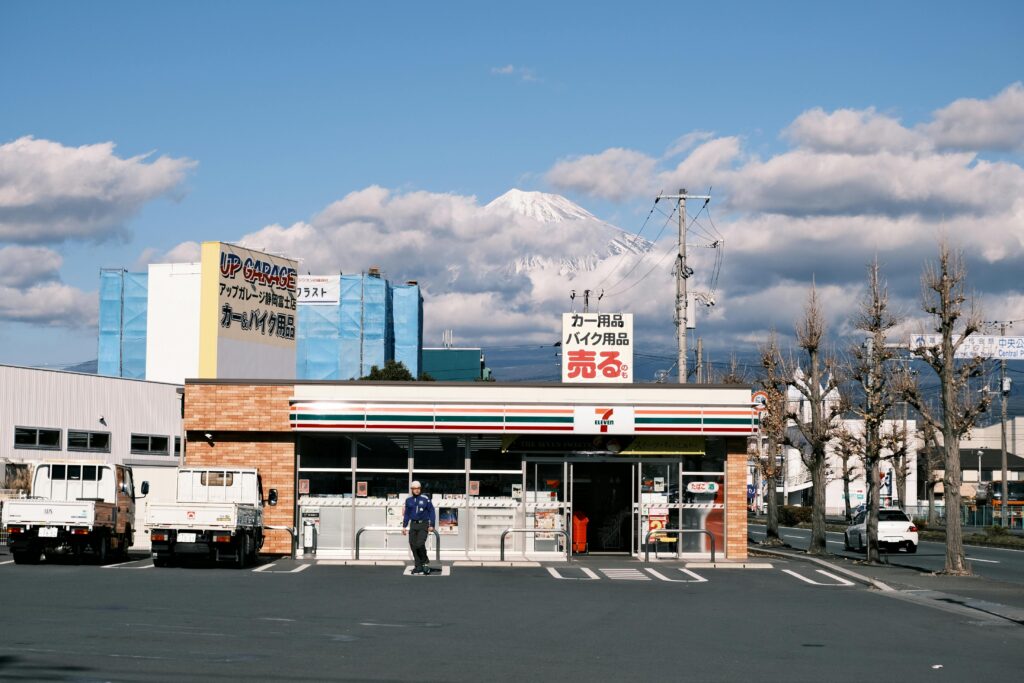 7-Eleven shop with Mt. Fuji backdrop in Fuji City, capturing urban and natural contrast.