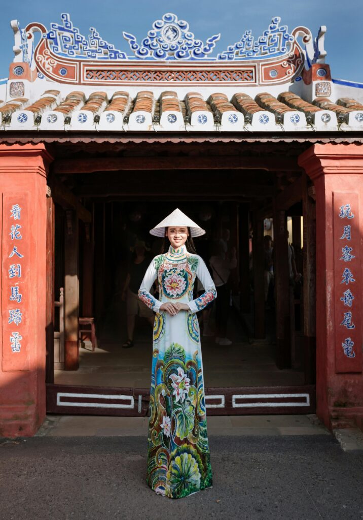 Portrait of a woman in an ao dai in Hội An, showcasing Vietnamese culture and heritage.