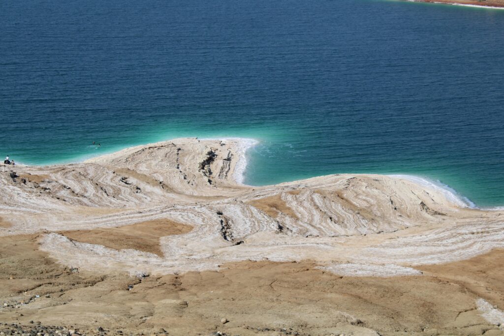 A striking aerial view of the Dead Sea's salt formations and blue waters.