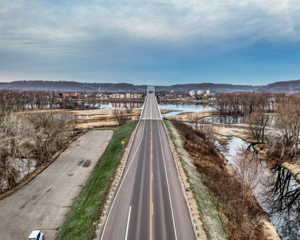 A scenic aerial view of a bridge over the Mississippi River in Wabasha, Minnesota, during winter.
