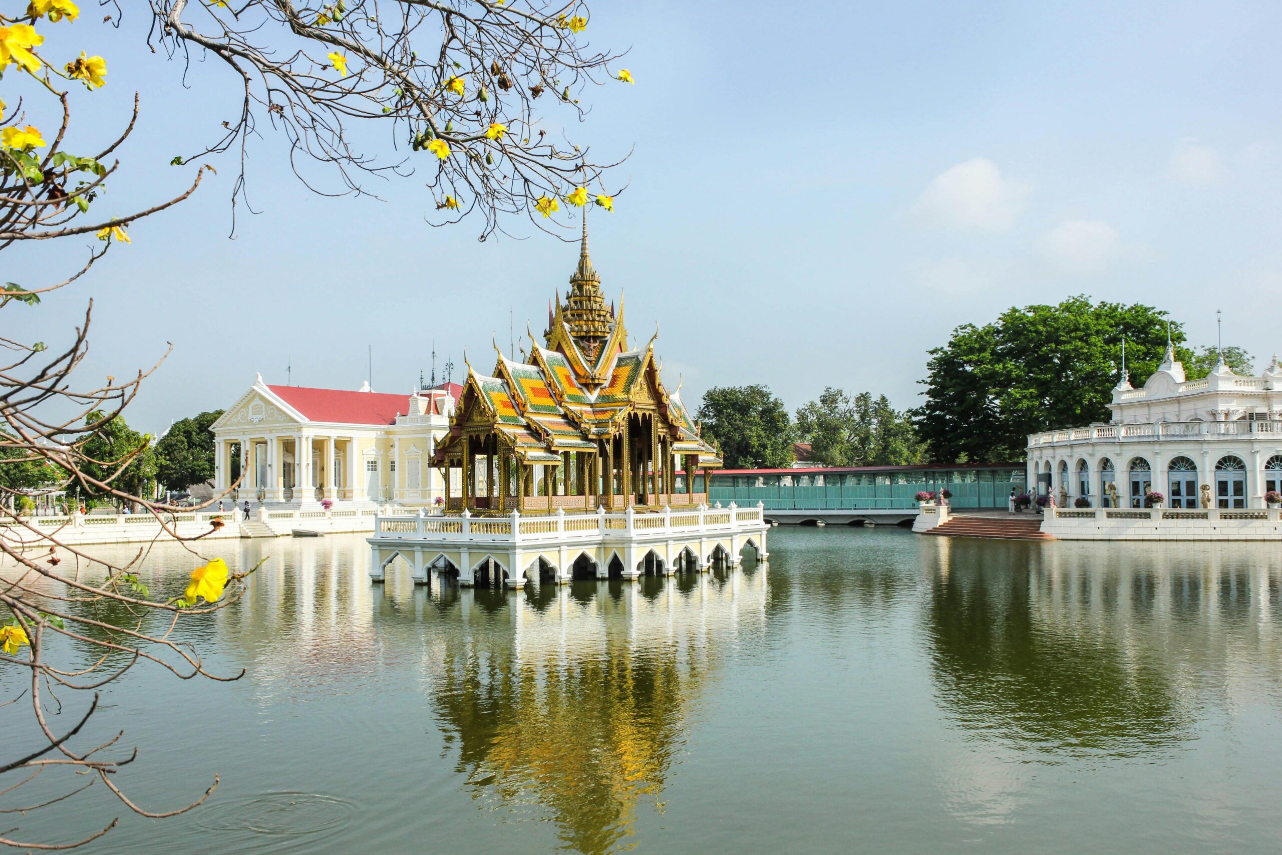 Scenic view of Ban Pa-In Palace reflecting in the calm waters of Chao Phraya River, Thailand.