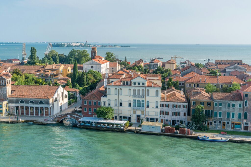 Scenic aerial view of Venice highlighting traditional architecture and calm lagoon waters.