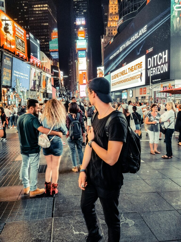 Bustling scene in Times Square, New York City showcasing the vibrant nightlife and diverse crowd.
