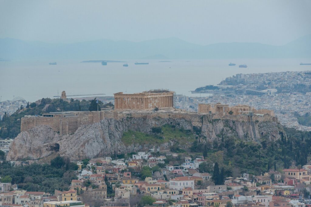 Stunning aerial view of the Acropolis of Athens, showcasing ancient Greek architecture and cityscape.