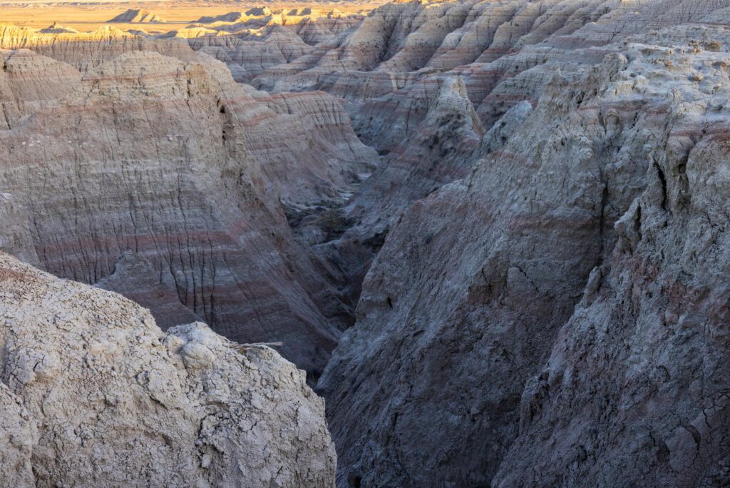 Explore the dramatic geological formations of Badlands National Park, USA.