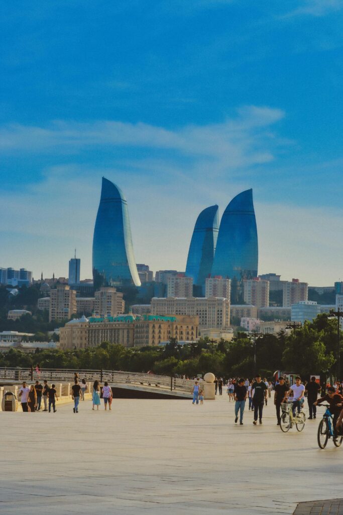 Stunning view of Baku's skyline with the iconic Flame Towers under a clear blue sky.