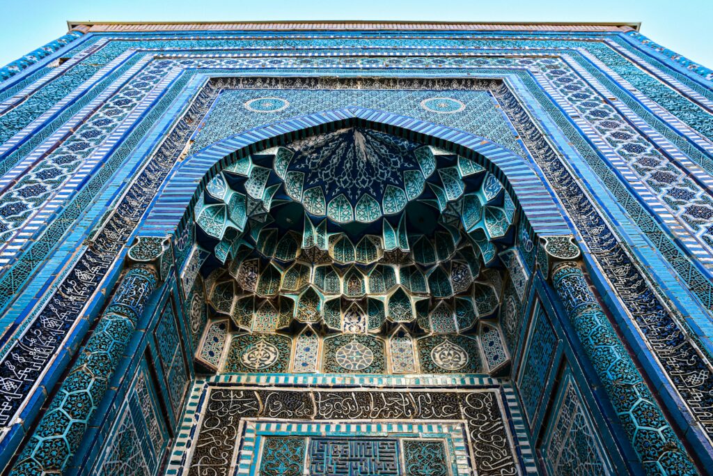 Detailed architectural tile work at Shah-i-Zinda in Samarkand, showcasing Islamic artistry.