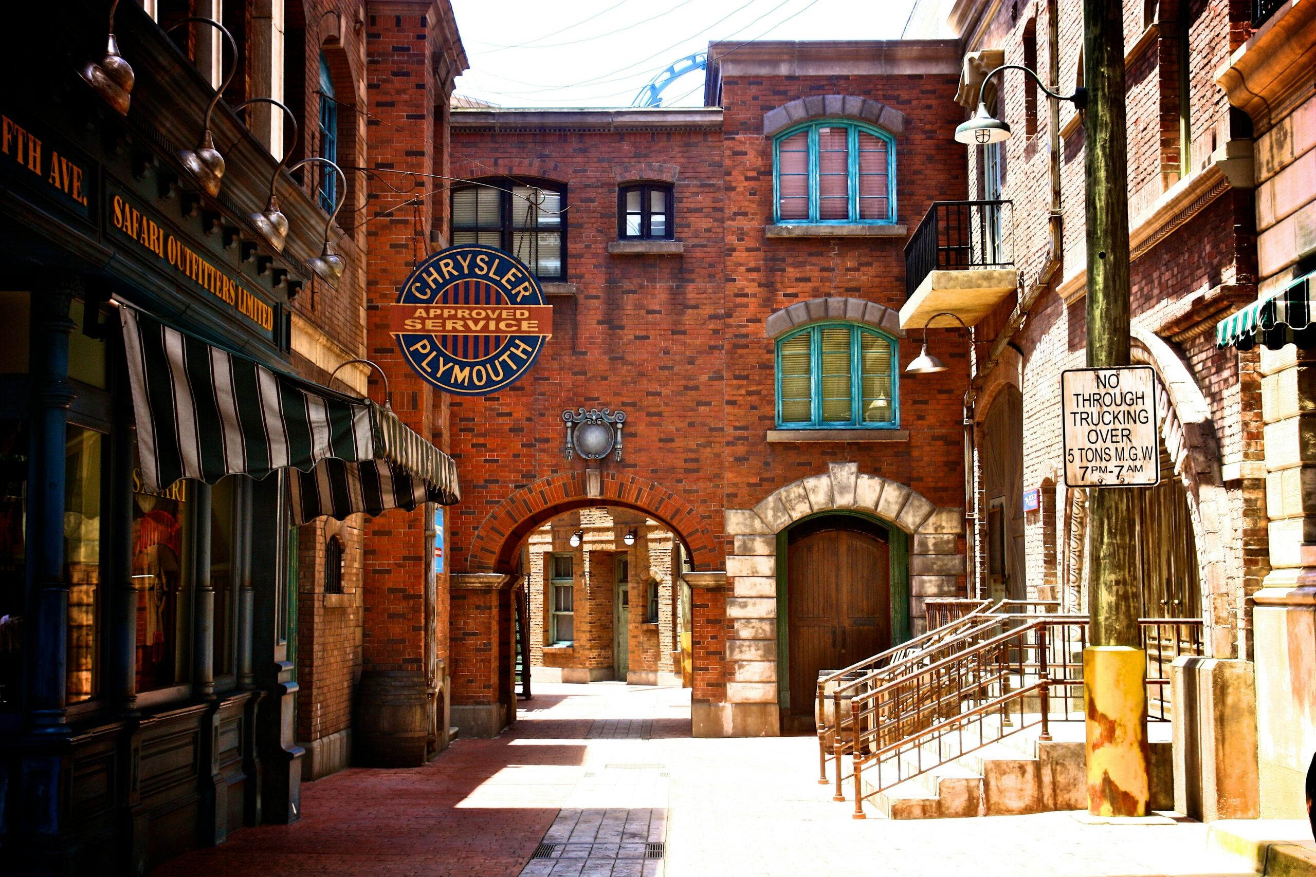 Capture of a vintage-style urban street with brick facades and unique architectural details.