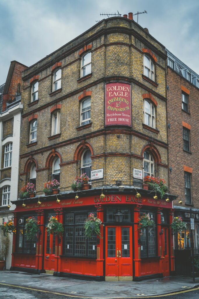 Quaint street view of the Golden Eagle pub's classic brick facade in London, England.