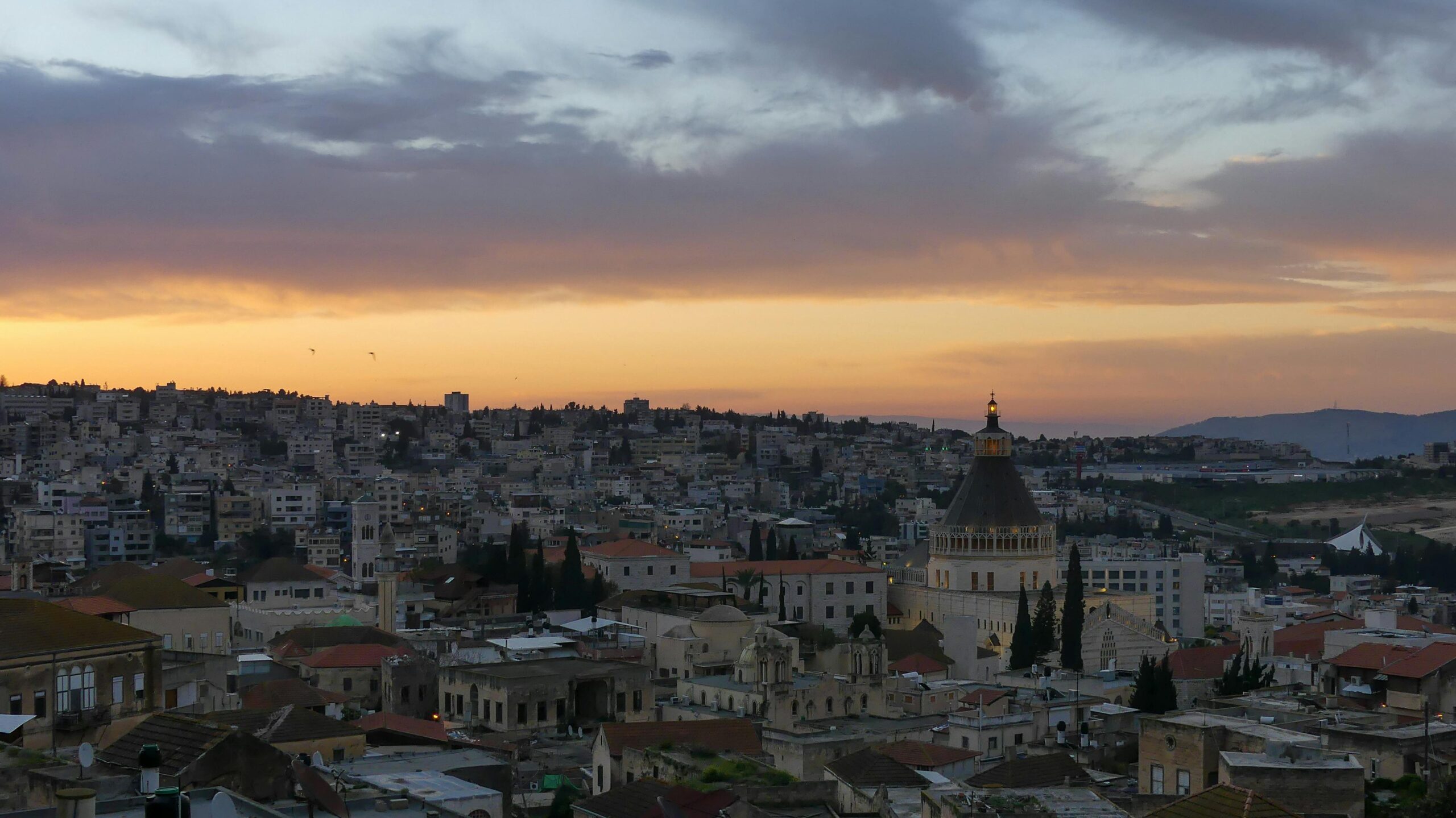 A stunning sunset over Nazareth showcasing the panoramic cityscape and iconic basilica.
