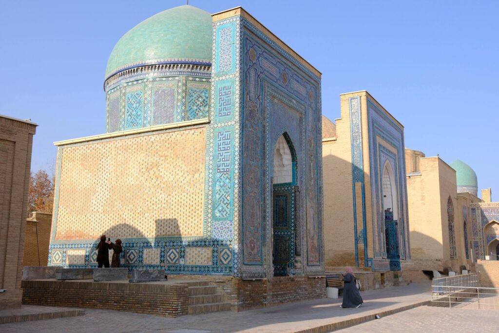 Ornate mausoleum with blue tiles in Samarkand's Shah-i-Zinda complex.