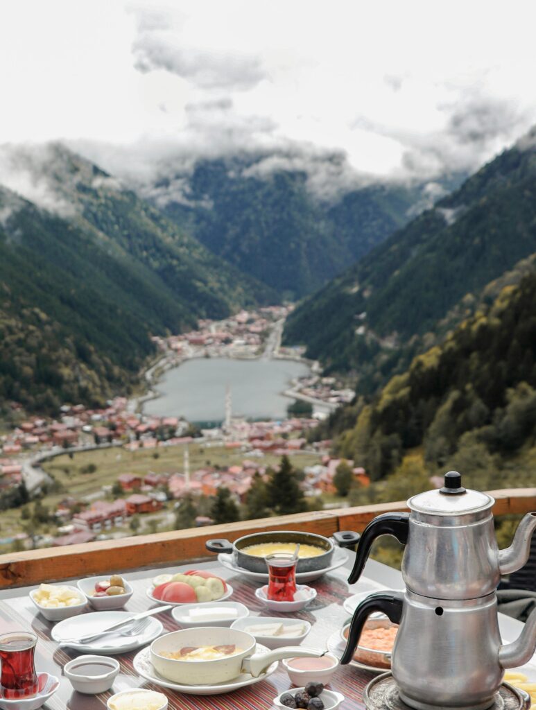 Enjoy a traditional Turkish breakfast with a stunning mountain view in Trabzon, Turkey.