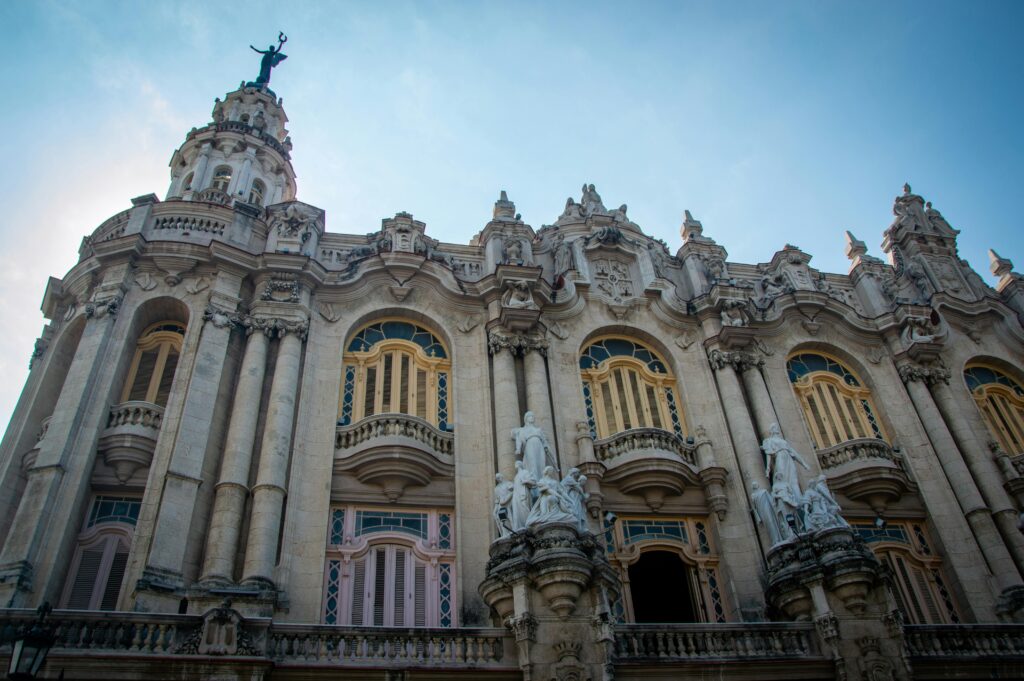 Stunning baroque architectural facade in Havana, Cuba under a clear blue sky.