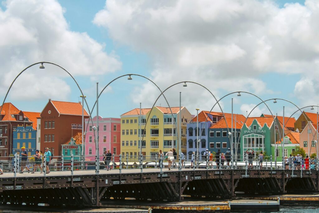 Colorful historic buildings and Queen Emma Bridge in Willemstad, a top travel destination in Curaçao.