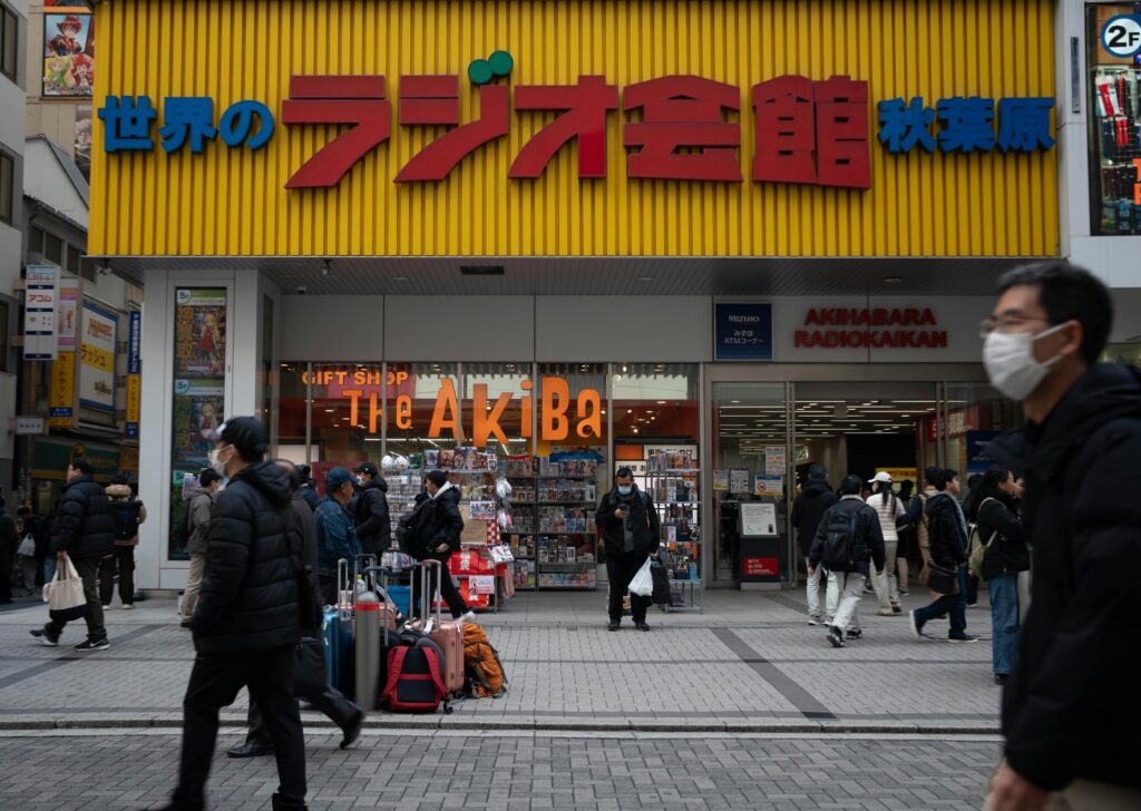 People shopping outside Akihabara Radio Kaikan in Tokyo, Japan.