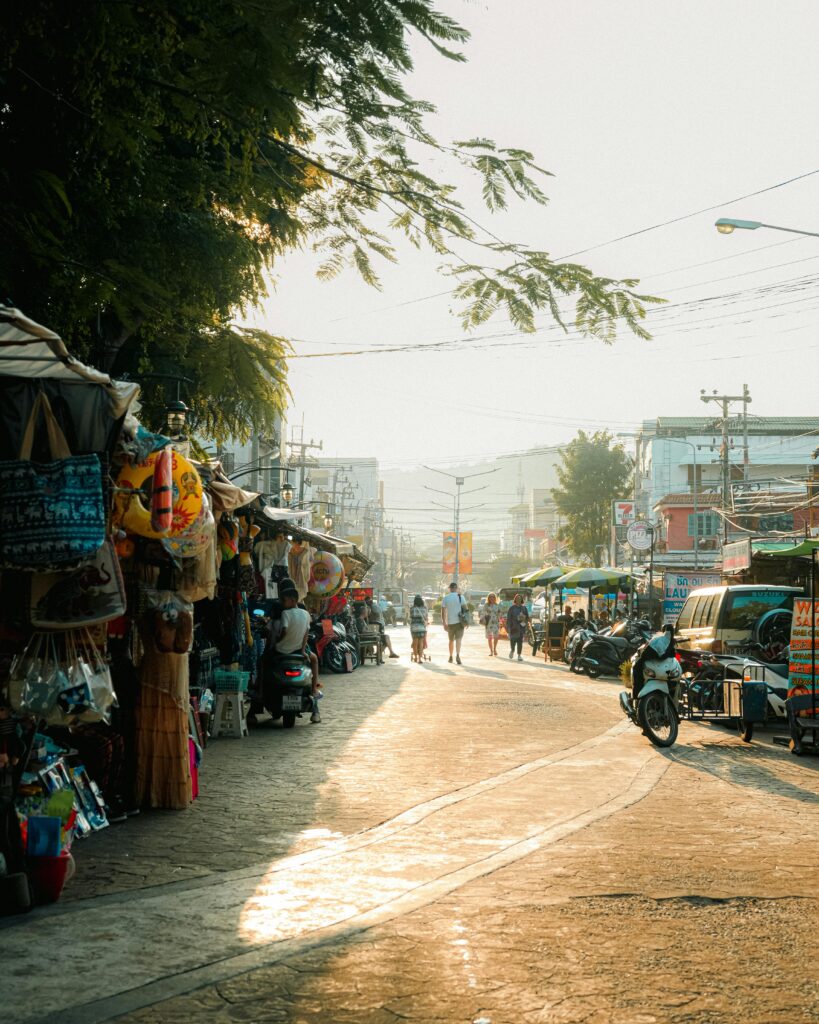 Explore a bustling Thailand street market at sunset, capturing vibrant energy and local culture.