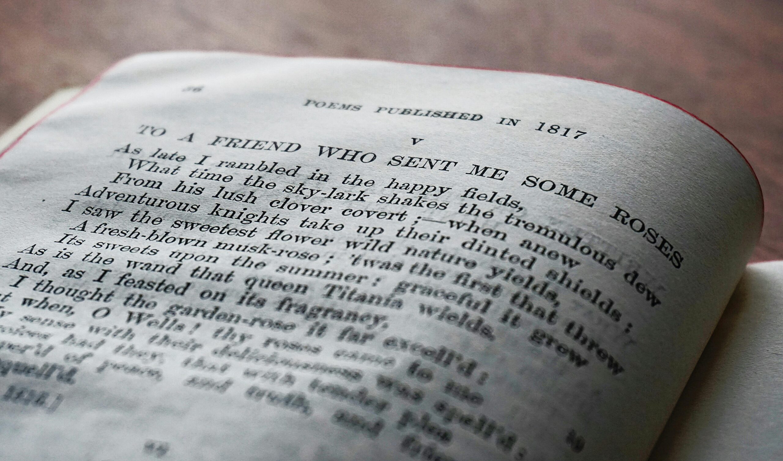 Close-up of a vintage book page with a poem published in 1817.
