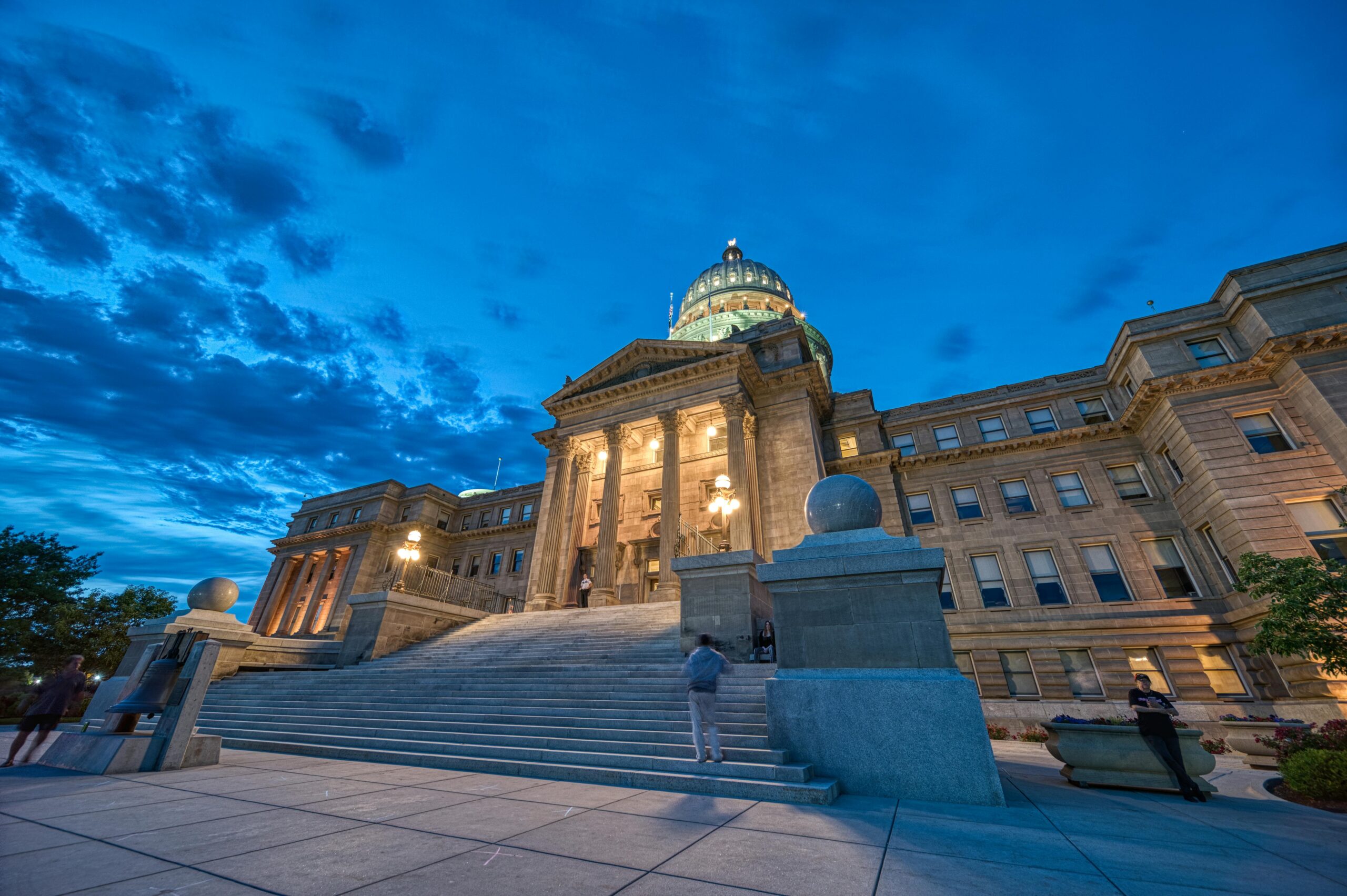 Idaho State Capitol building captured at dusk with architectural grandeur and low angle view.
