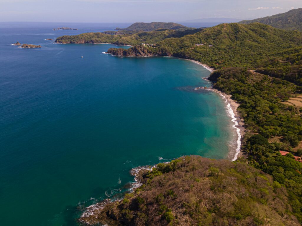 A breathtaking aerial view of the lush coastline and blue waters in Guanacaste, Costa Rica.