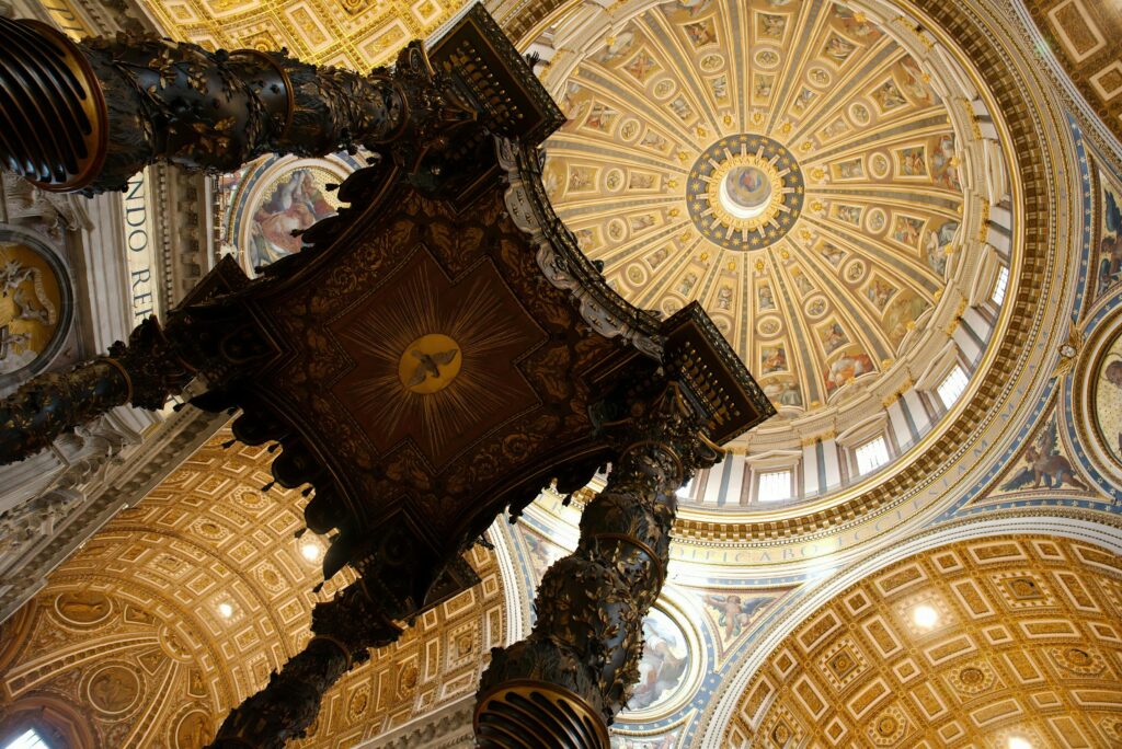 Majestic view inside St. Peter's Basilica showcasing its iconic dome and ornate architecture.
