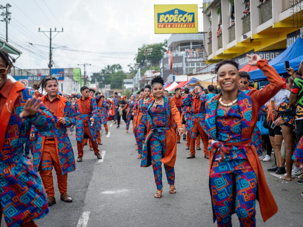 Colorful street parade in Limón, showcasing Afro-Costa Rican culture and vibrant costumes.