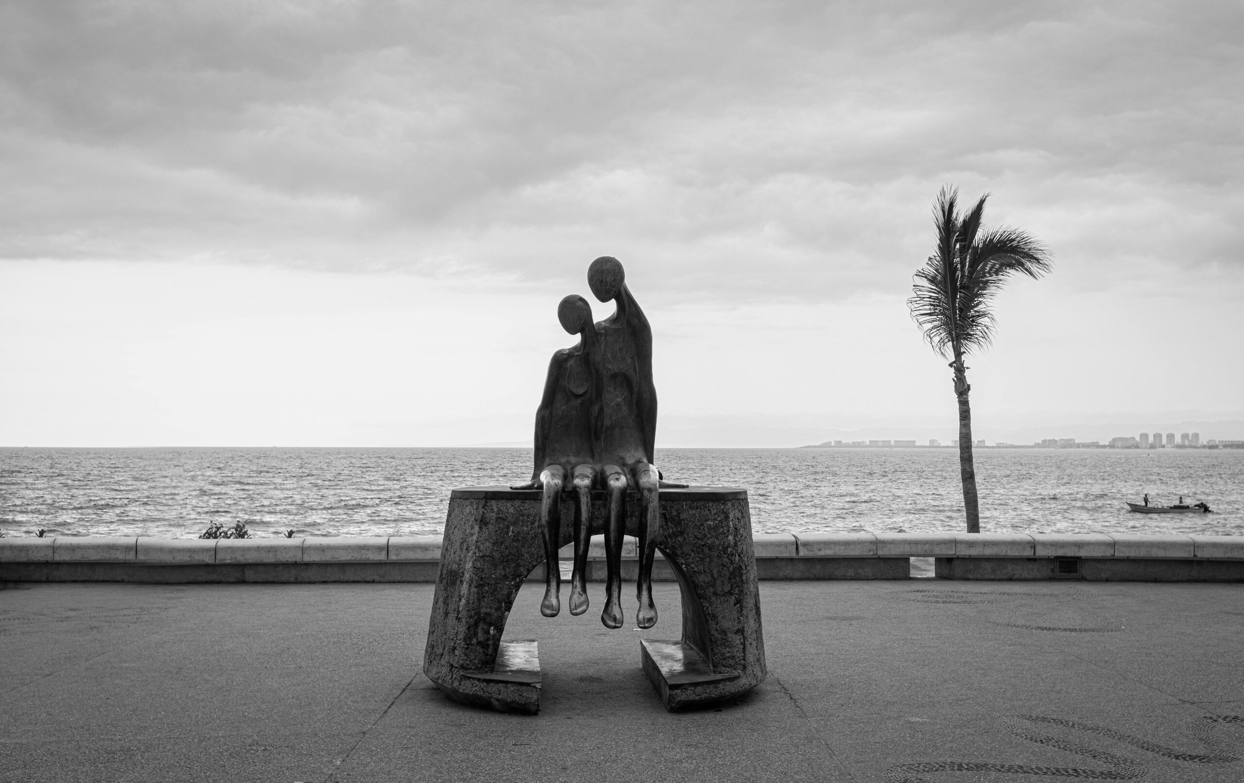 Dramatic black and white shot of famous sculpture on Puerto Vallarta Malecón, Mexico.