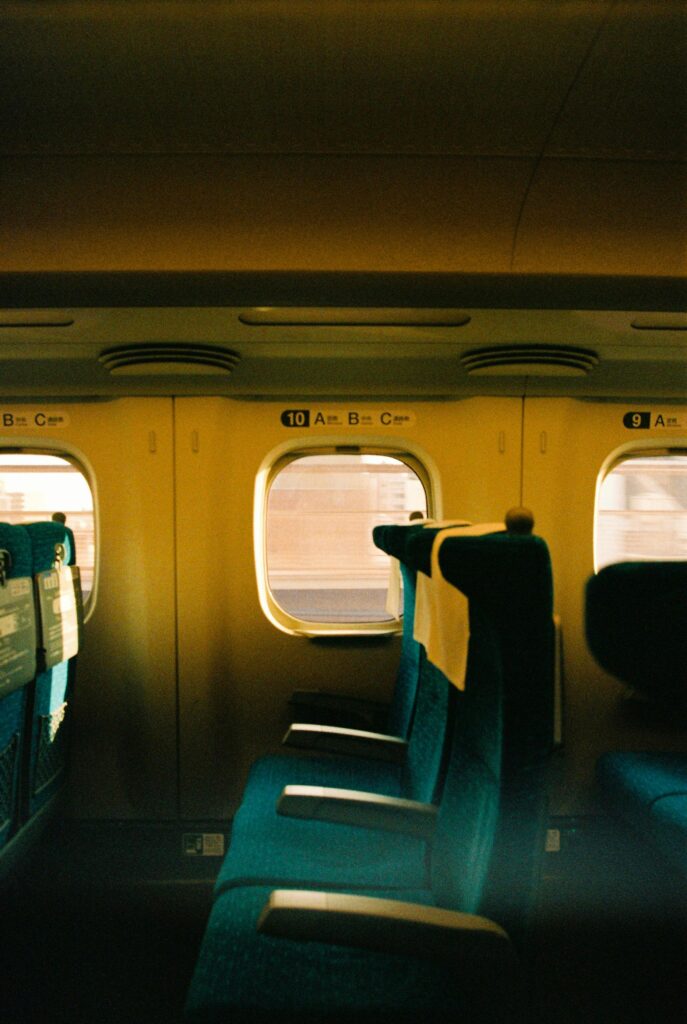 Empty seats inside a Japanese bullet train, capturing the essence of travel and modernity.