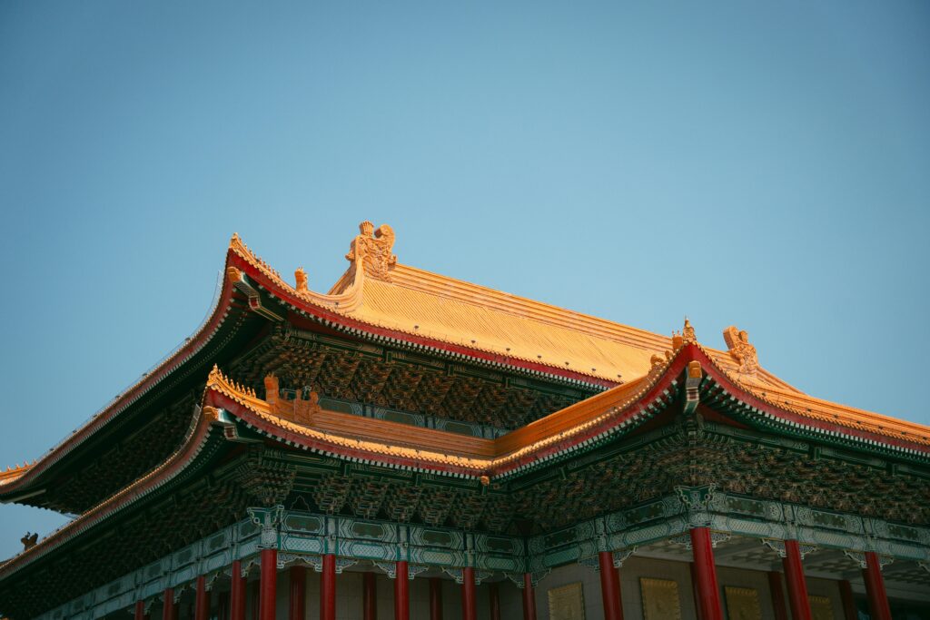 Beautiful rooftop of traditional Taiwanese architecture in Taipei under a clear sky.