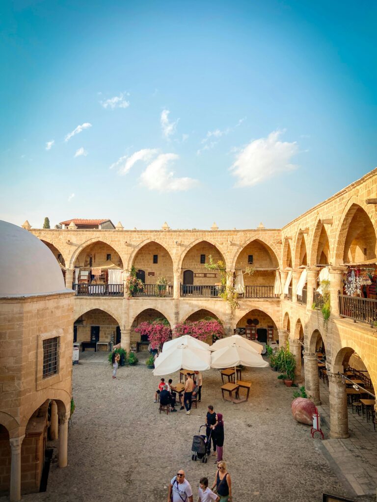 Explore the bustling courtyard of the iconic Buyuk Han, a landmark in Nicosia showcasing Ottoman architecture.