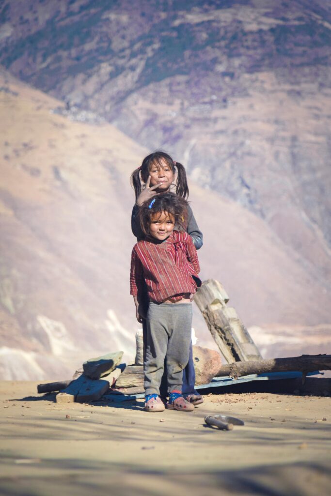 Two children enjoying a day in the remote Himalayan region of Nepal.