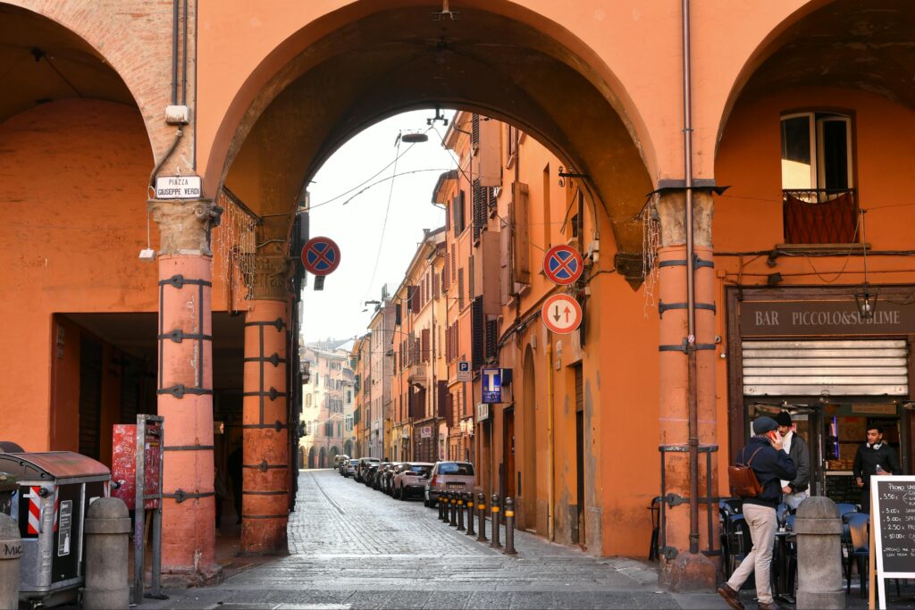 A vibrant street view of Piazza Giuseppe Verdi with classic Italian architecture and people.
