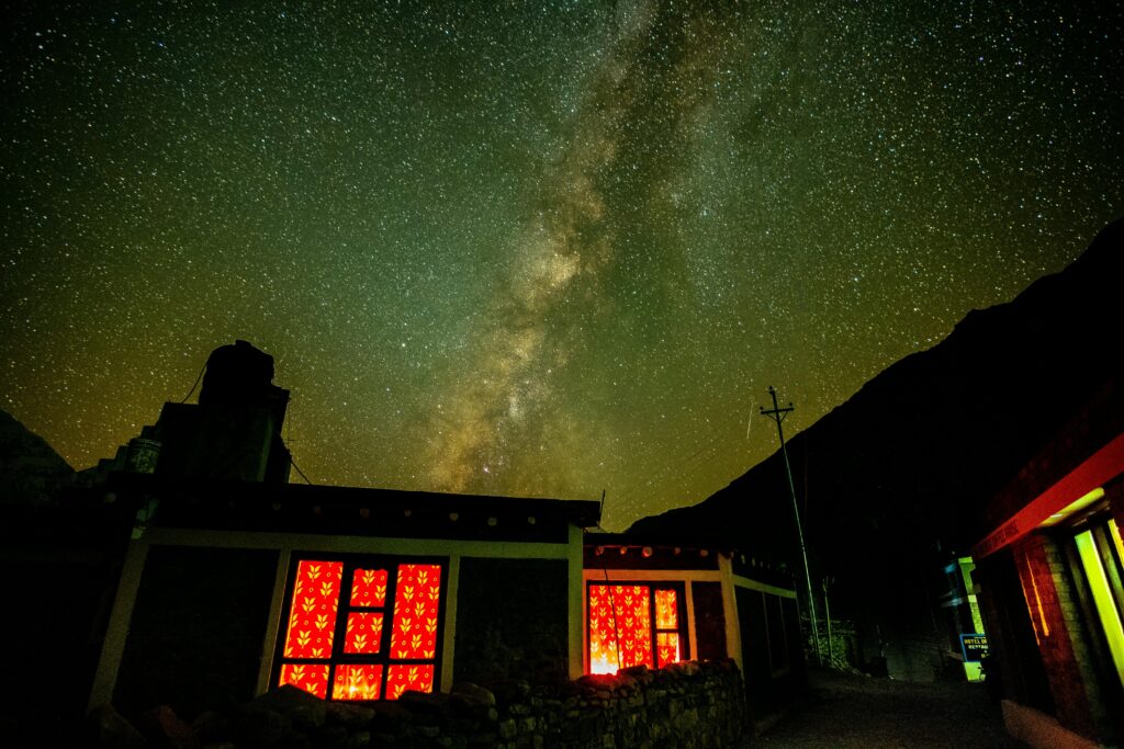 Vibrant starry sky and Milky Way over traditional house in Kagbeni, Nepal.