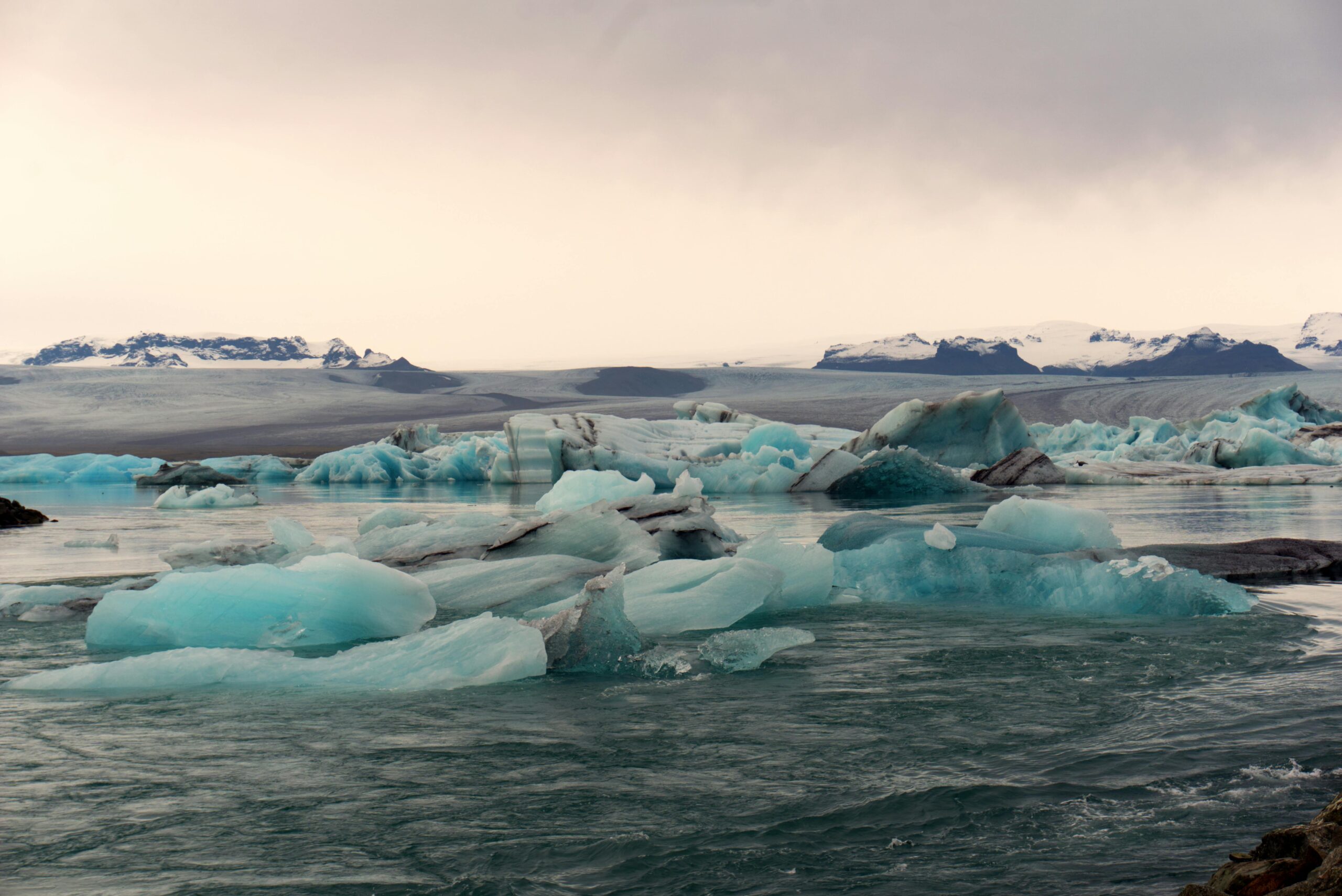 Breathtaking view of icebergs floating in the serene Jokulsarlon Glacier Lagoon, Iceland.