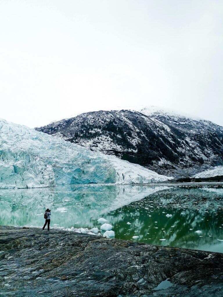 Person exploring Glacier in Patagonia, capturing stunning winter scenery in Río Negro, Argentina.