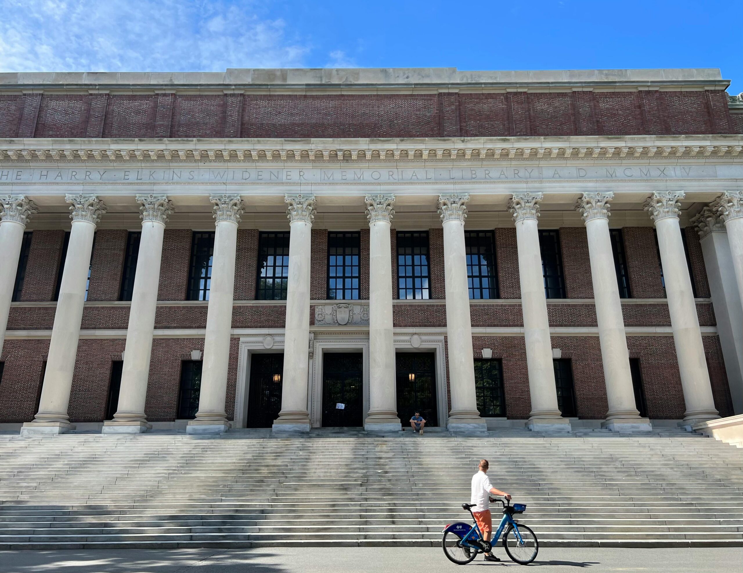 Harvard University's iconic Widener Library with cyclist in front, Cambridge, MA.