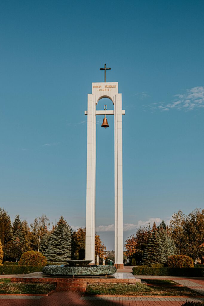 Explore the Serpeni Memorial Bell Tower, a prominent landmark in Moldova's serene park setting.