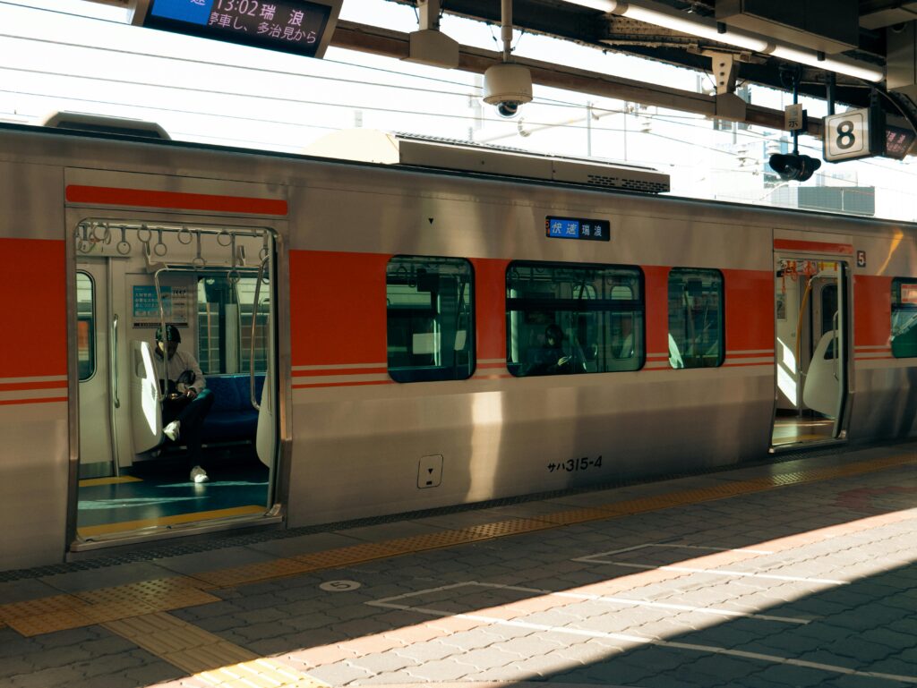A train awaits passengers at Nagoya Station, capturing urban transit in Aichi, Japan.