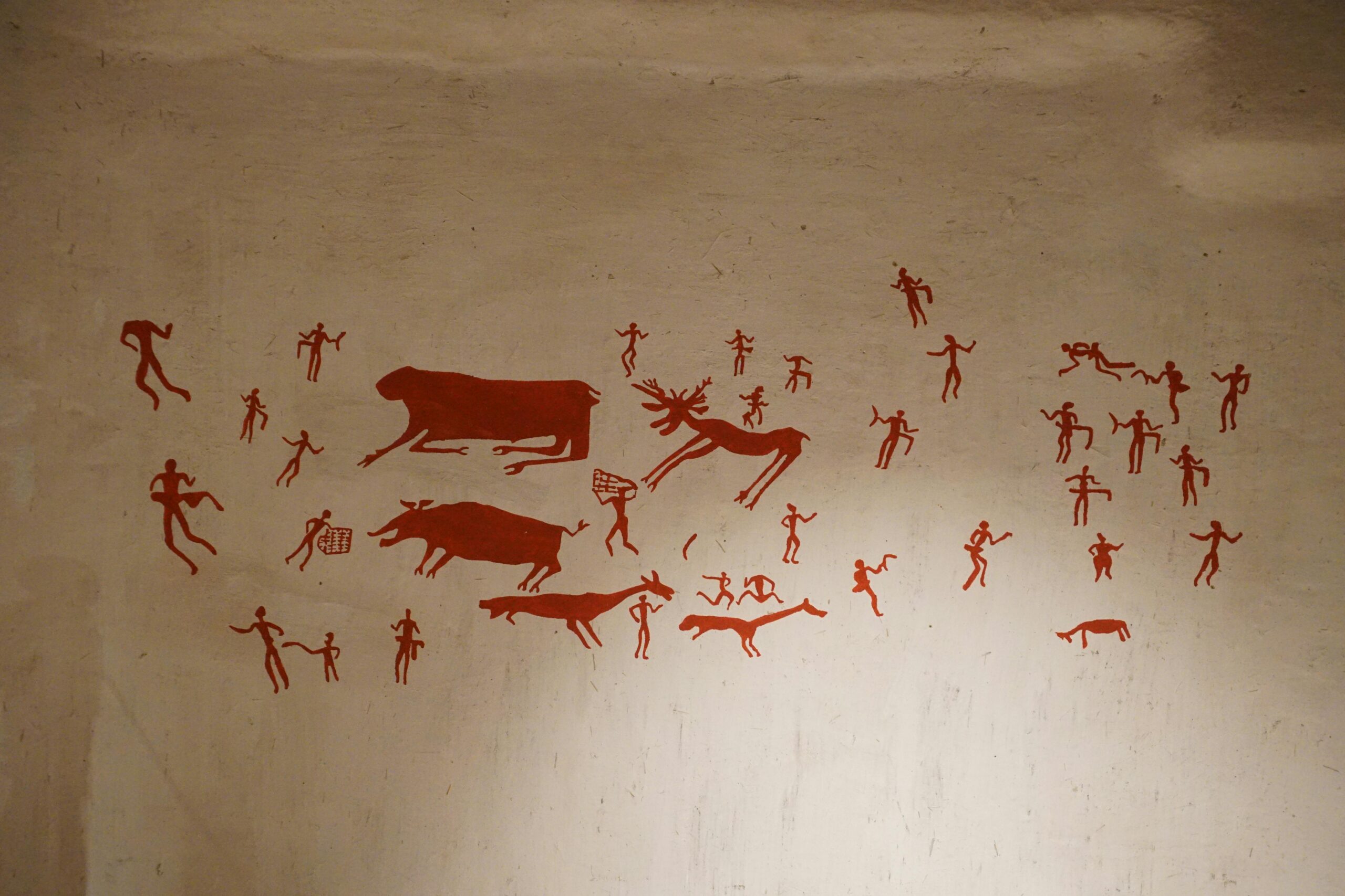 Çumra cave art showcasing ancient human and animal figures on a wall in Konya, Türkiye.