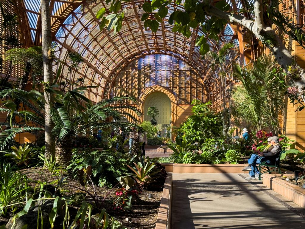 Lush greenery and architectural beauty inside the Botanical Building at Balboa Park, San Diego.